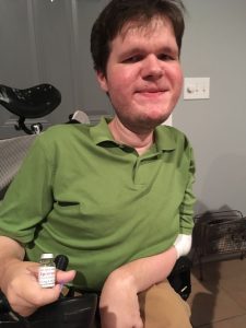 Matt
holding a bottle of Spinraza.